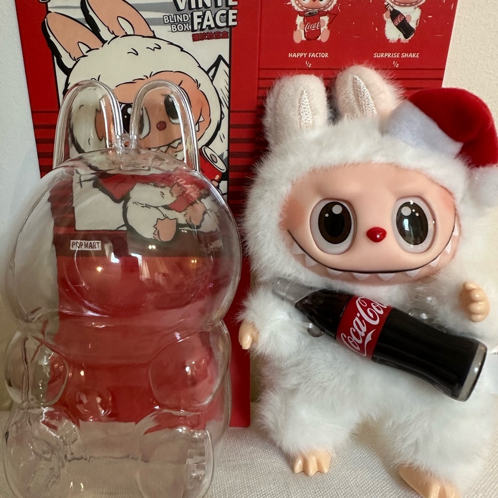 It’s a Authentic Coca-Cola Christmas Labubu w/ carring case